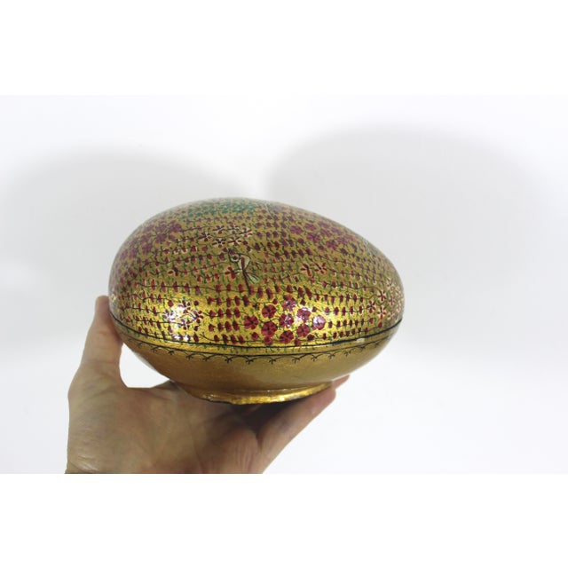 Beautiful vintage Kashmir egg shaped trinket box made from papier maché, hand painted with intricate gold detail and then...