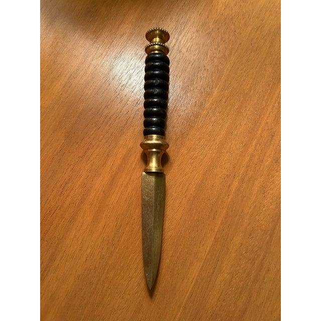 1970's 7.5" long brass and wood letter opener. Ornate brass finial and round wood handle. Great vintage desk accessory for...