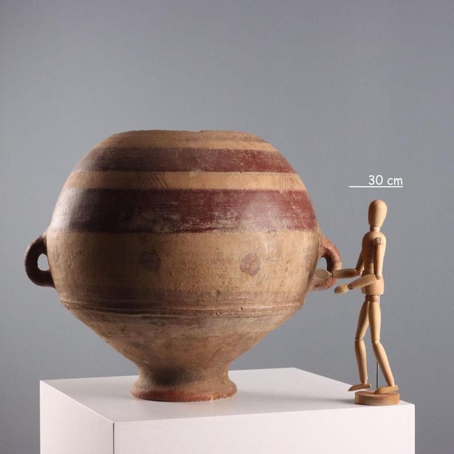 A terracotta vase used to store flour and grains. Mali, Mopti region. This piece is attributed to the mentioned...