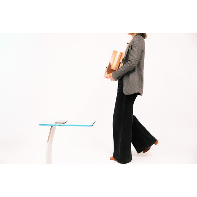 A sleek time capsule from the late ’70s, this cantilever side table combines sculptural steel engineering with a polished...