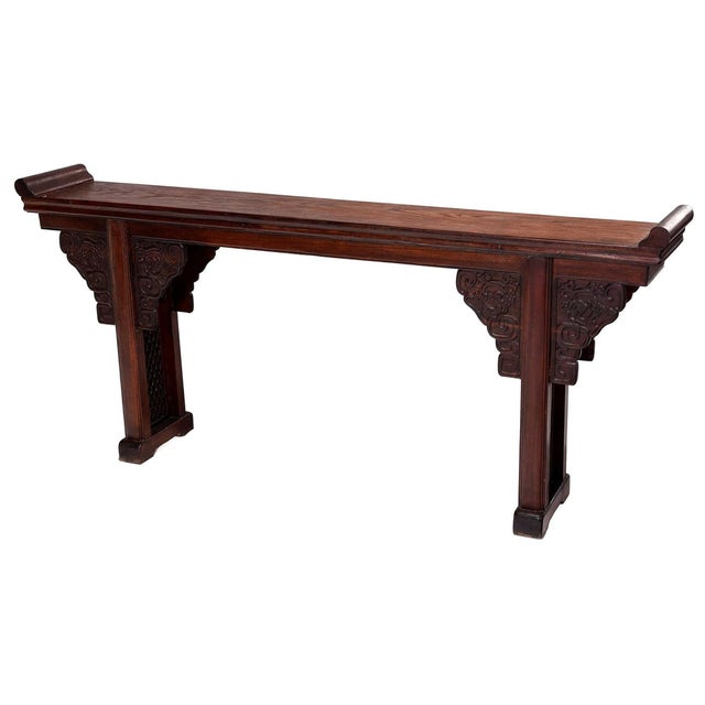 20th century, single board top with two supports, applied geometric and dragon carved elements at supports, reticulated...