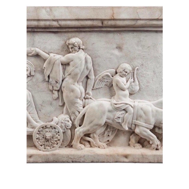 This solid marble hand-carved relief, Triumph of Bacchus, beautifully depicts the god of wine and festivity in a jubilant...