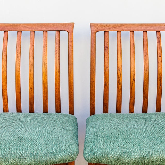 A newly restored set of 8 solid teak slat back dining chairs by Folke Ohlsson, made in Sweden by DUX c. 1960s....