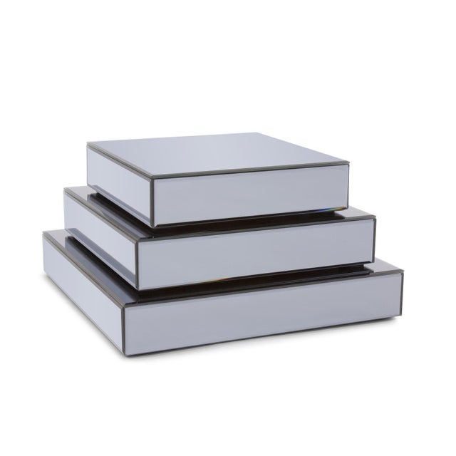 These square mirrored display platforms finished in Smokey gray will give a unique way to display those special treasures....
