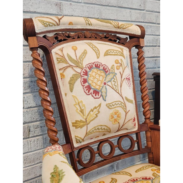 A striking late-19th-century George Hunzinger platform rocking chair featuring his distinctive “lollipop” circular motifs,...