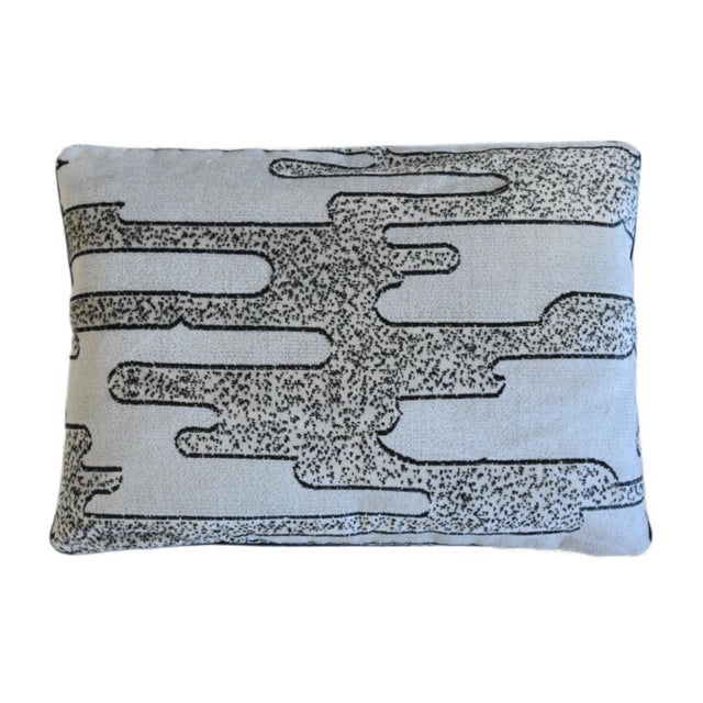 A custom-tailored pillow by Mike Seratt of The Prized Pig in designer Romo Textiles "Salvador" velvet fabric depicts a...