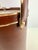 A vintage mid century cocktail ice bucket finished in rich brown leatherette with stitched detailing and polished gold-...