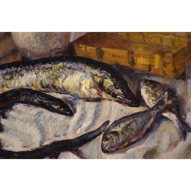 Still Life with Fishes is an original oil painting on wood panel realized around 1935 by an anonymous artist of the...