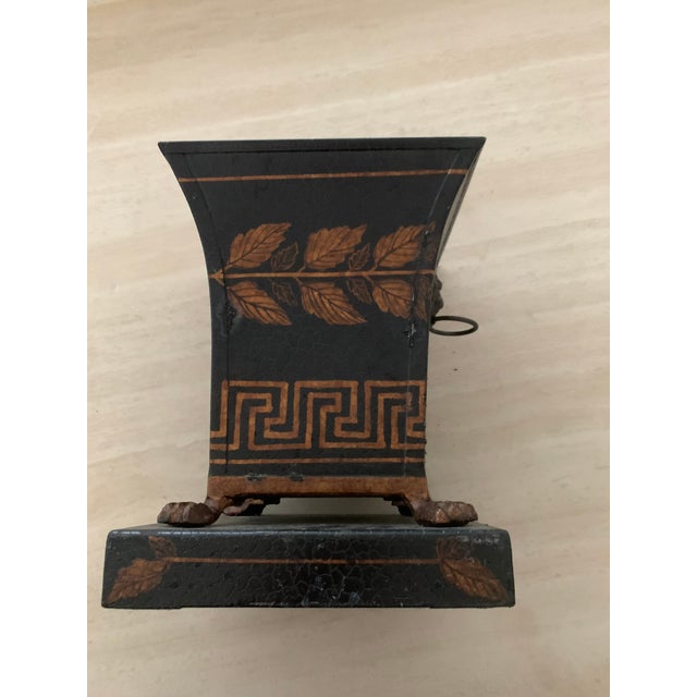 Metal vase hand painted with gold leaves. Has rings on each side for accents. Perfect condition but 10 years old.