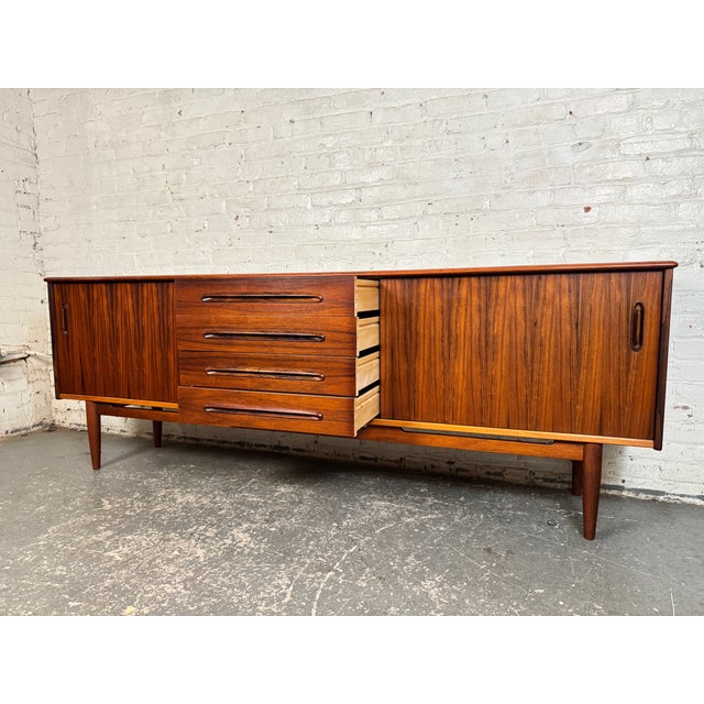 Impressive Brazilian rosewood / jacaranda sideboard designed by Nils Jonsson for Troeds Bjärnum. A classic example of...