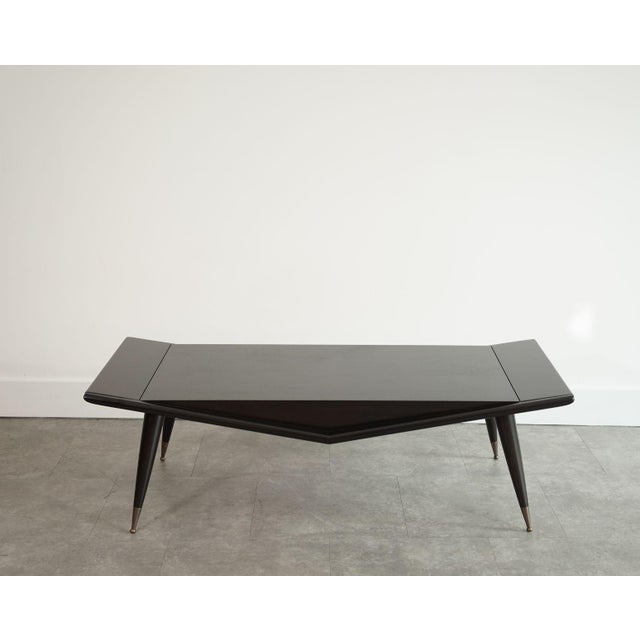 Inspired by the iconic Italian modernism of Ico Parisi, this sculptural coffee table embodies the elegance and fluidity of...