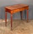 A fine English console serving or hall table of mahogany from the William IV era, featuring a rectangular top over a...