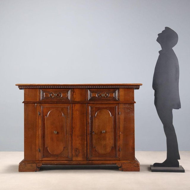 Baroque-style walnut sideboard, crafted from antique wood and parts in the 20th century. Carved frame under the top, front...