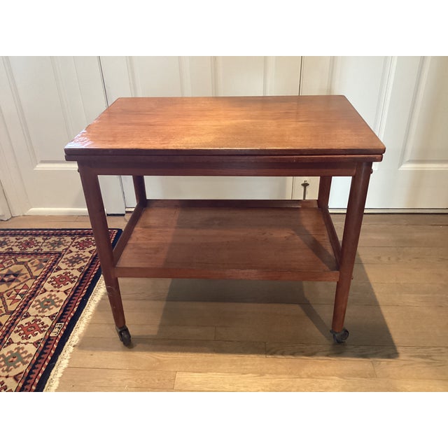1970s 1970s Midcentury Modern Teak Rolling Expandable Table With Shelf For Sale - Image 5 of 12