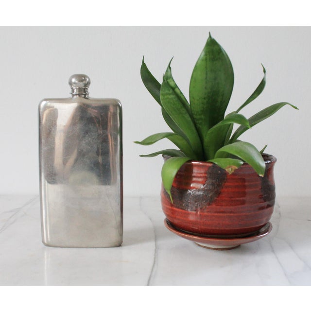 Vintage 6 ounce English pewter hip flask. Made in Sheffield England. Makers mark on bottom. Some age wear/dents.