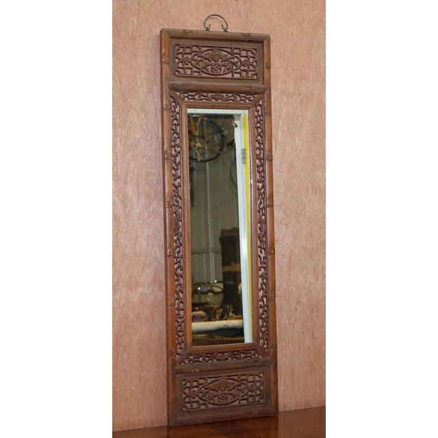 We are delighted to offer for sale this lovely ornately carved wood Chinese panel depicting six bats and a mirror plate in...