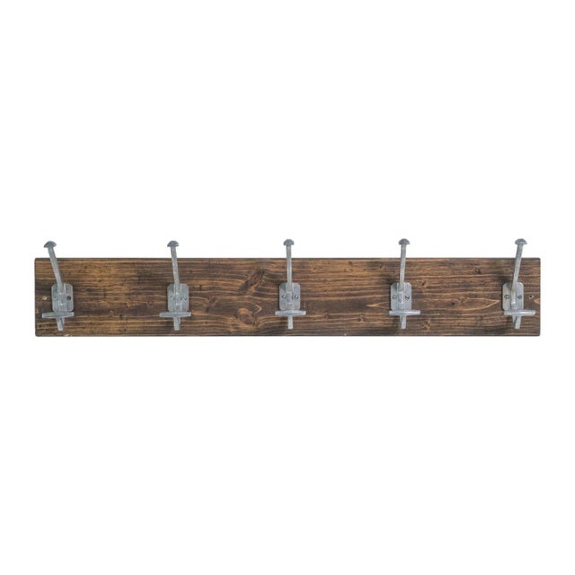 A 36-inch pine wall rack from Europe, adorned with five aluminum hooks. This piece combines European design and...