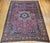 "This exquisite vintage Persian Khorassan rug, woven in the early 20th century. Set in a richly saturated crimson red...