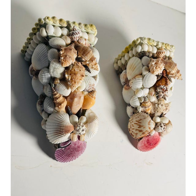 Vintage pair of wall brackets encrusted with sea shells.