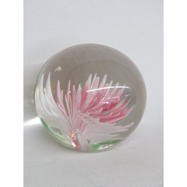 This wonderful Globe Paper Weight is made of glass. This beautiful Mid Century style glass sculpture features a compact...
