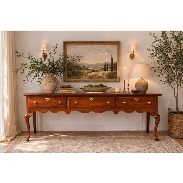 A monumental 77-inch sideboard from the Henkel Harris Virginia Galleries collection. Crafted from solid wild black cherry...