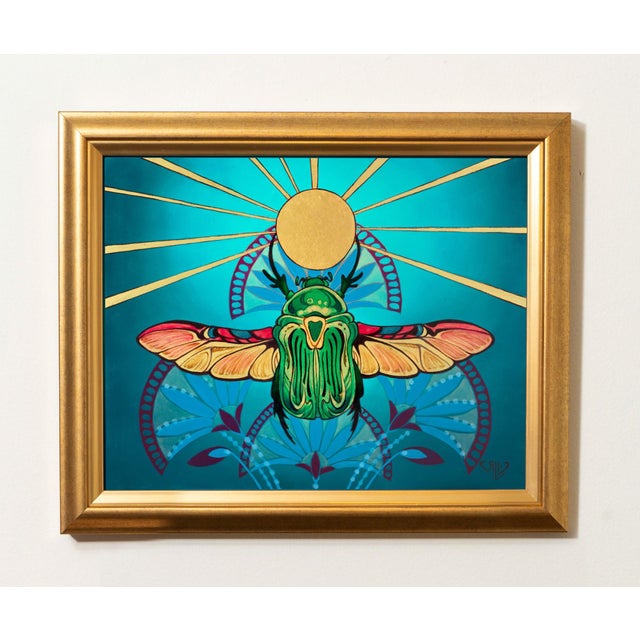 This artwork features a vibrant depiction of a scarab beetle, its intricate wings unfurled against a rich turquoise...