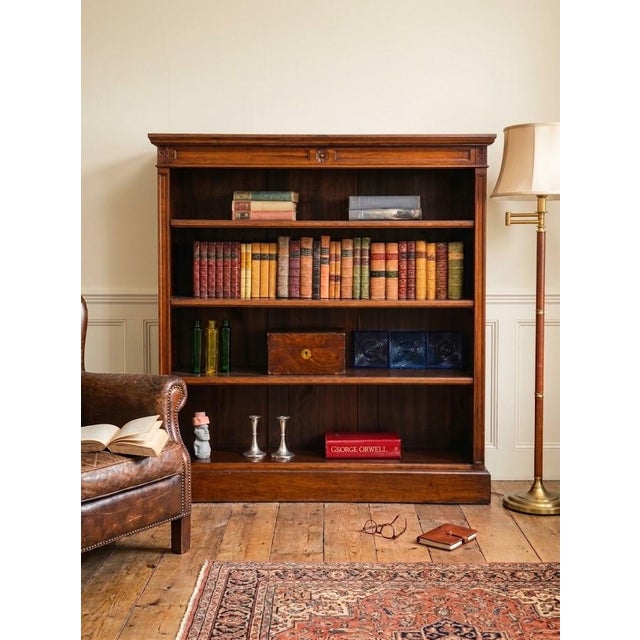 K0670 a late victorian english bookcase crafted from high-quality solid walnut, featuring solid walnut sides and a figured...