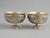 A substantial and decorative pair of Burmese silver bowls, made in Mandalay around 1900 and richly worked in hand-chased...