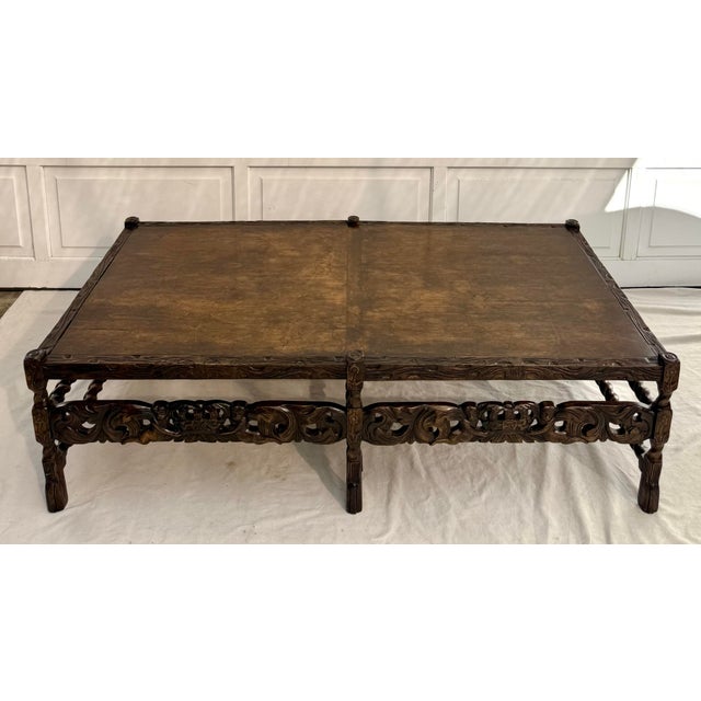 This classic carved wood coffee table draws from English Carolean and Renaissance Revival design traditions and was likely...