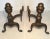 This pair of bronze andirons features classic lines and detailed work. The large finials give an air of importance and...