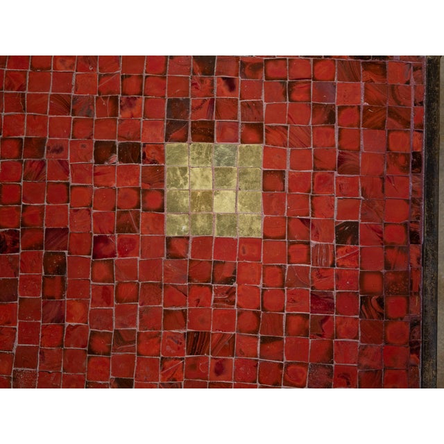 An Italian Midcentury mosaic coffee table with iron base and red glass tile style top. This Italian Midcentury mosaic...