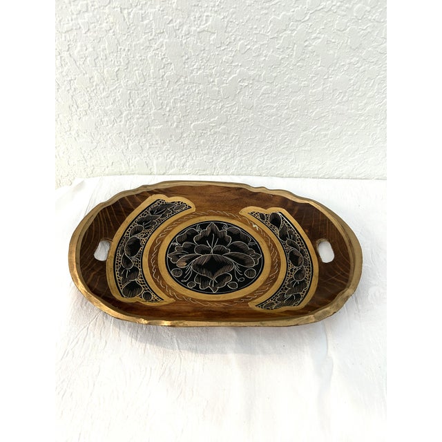 Beautiful midcentury, carved wood, double handle, shallow Mexican Batea bowl featuring a hand-painted floral motif in...
