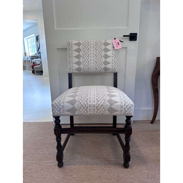 This dark walnut chair is absolutely antique, although I do not know its origins. It's handsome proportions and strong...