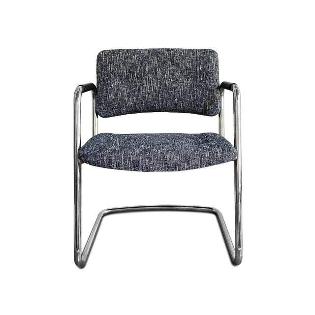 A vintage Steelcase custom cantilever chair that has been restored with new textured blue and white upholstery. The accent...