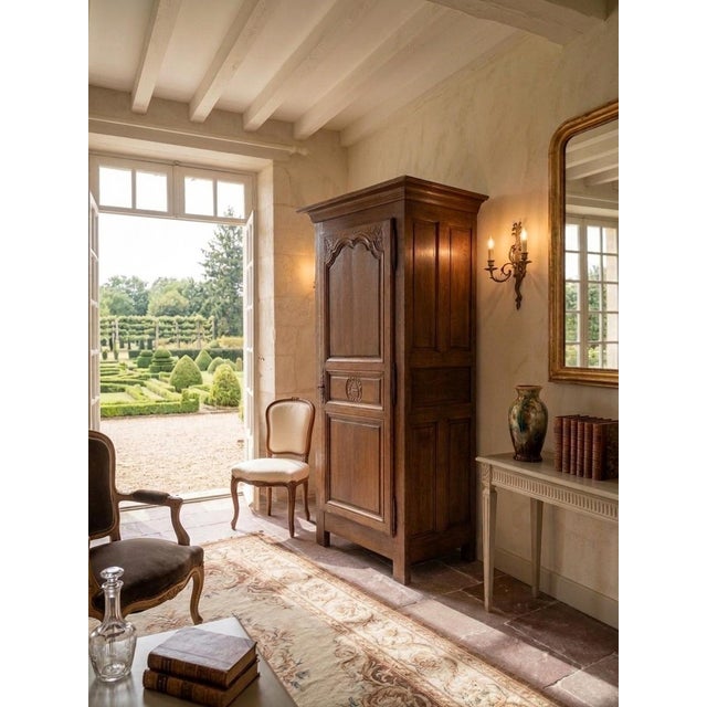 French Provincial Carved Walnut Bonnetière Cabinet, Normandy, 1860s, in Flawless conditions. Designed before 1890 This...