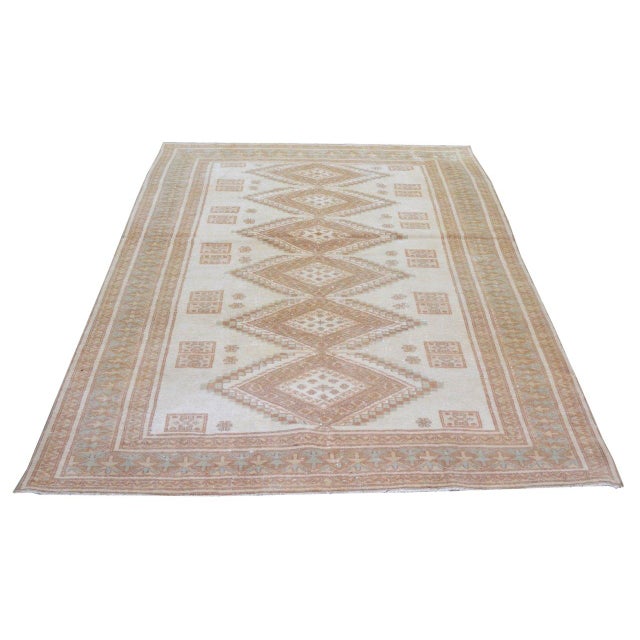 Hand-knotted with care using traditional rug-making techniques, this wool rug blends timeless craftsmanship with a modern...