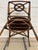 This is alleged iconic vintage McGuire Rattan 'Target Back' armchair, originally designed by Elinor McGuire. It features a...