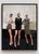 This oil on panel artwork presents a trio of elegantly posed figures, each embodying a distinct attitude and expression....