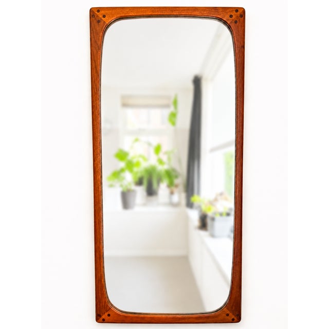 Large scandinavian modern wall mirror with a solid teak frame and softly rounded corners attributed to aksel kjersgaard....