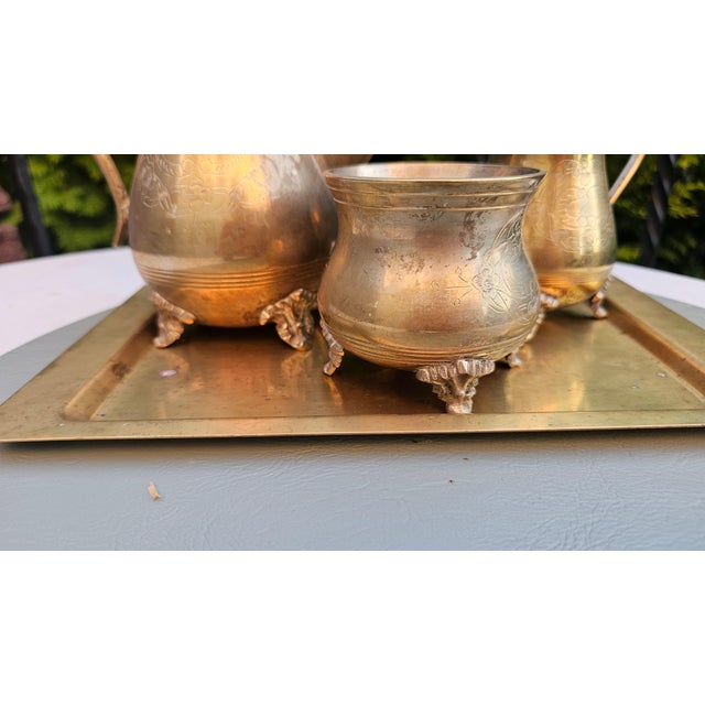 Pre-war brass set, marked EPNS: tray, teapot, sugar bowl, milk jug,dimensions: tray – height 28.3 cm, width 17.6 cm, depth...
