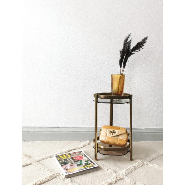 This fantastic, narrow side table was crafted in the 1970s and perfectly captures the slightly decadent spirit of the...