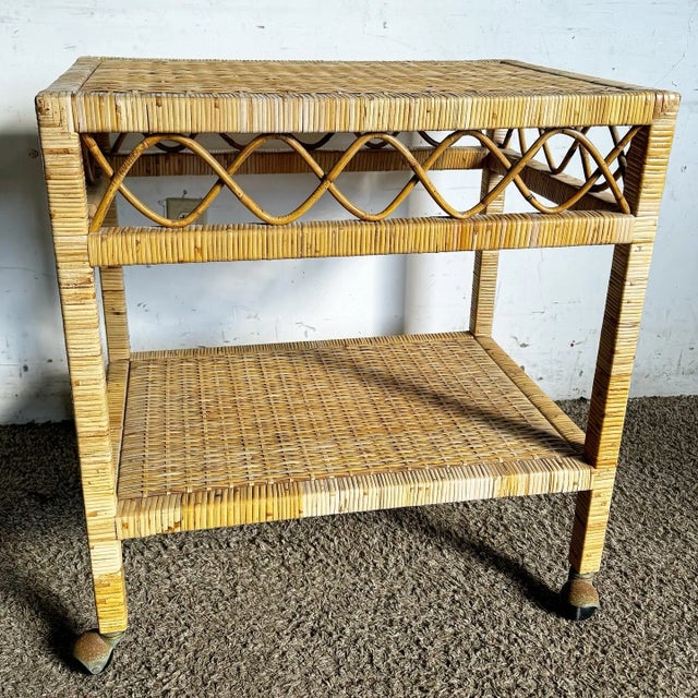 This charming boho chic wicker cart offers style and practicality. Featuring two tiers of woven wicker shelves and...