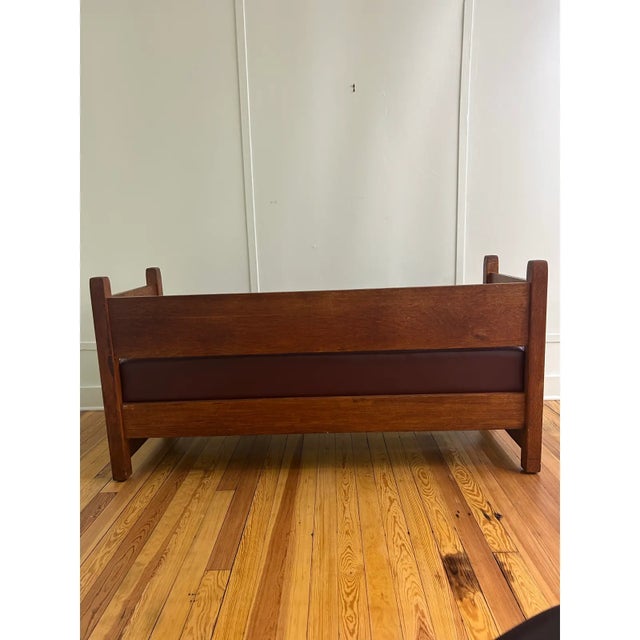Beautiful solid oak mission-style bench attributed to Stickley. Newly re-upholstered in leather, featuring a rich brown...