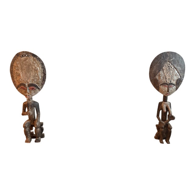 Monumental Hand-Carved West African Figural Sculptures With Cowrie & Textile Masks — Pair For Sale