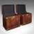 This is a pair of late vintage luggage trunks. An English, leather and brass bedside nightstand, or occasional tables with...