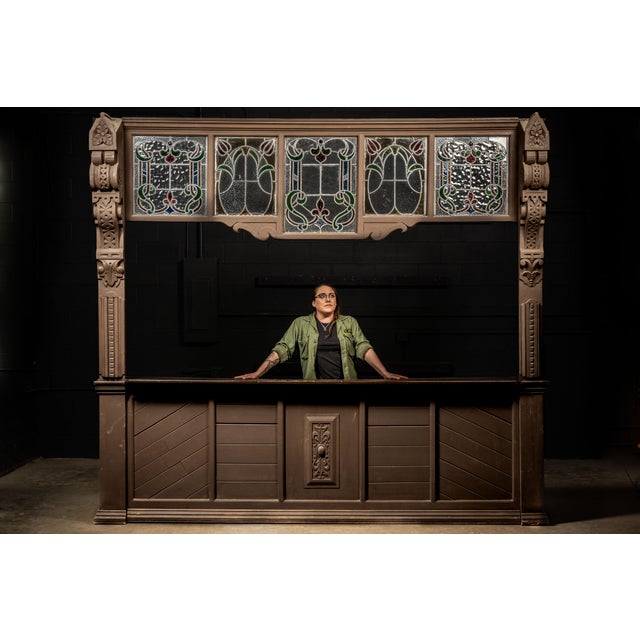 Monumental Gothic Revival architectural bar front executed in wood with an elaborate arrangement of stained and textured...