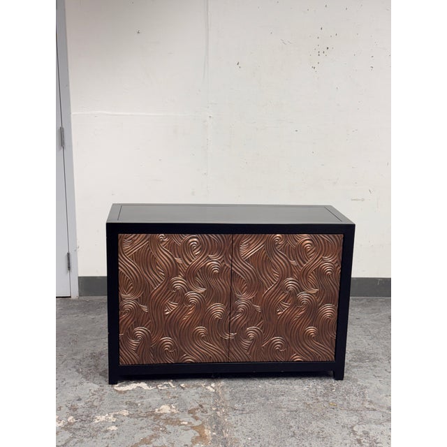 Design Plus Gallery presents the Dragon Swirl Bar Cabinet by Robert Kuo from McGuire Furniture. Its captivating swirled...