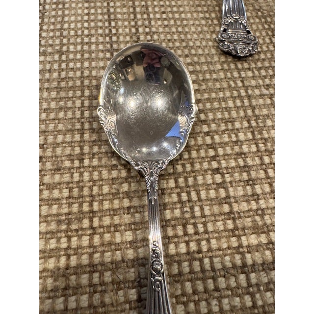 Towle sterling silver sugar spoon in the Georgian pattern, patented 1898. It has an engraved stylized script monogram "A"...