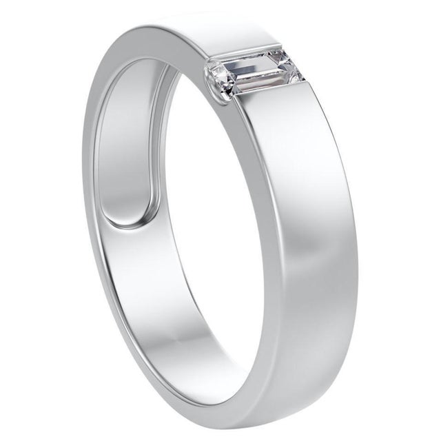 Tension set wedding band in a brushed satin platinum finish, featuring a tension set emerald cut diamond. This piece has...