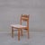 An upholstered set of dining chairs in a white boucle style fabric. Denmark, c1960s. Oak framed, heavily attributed to...